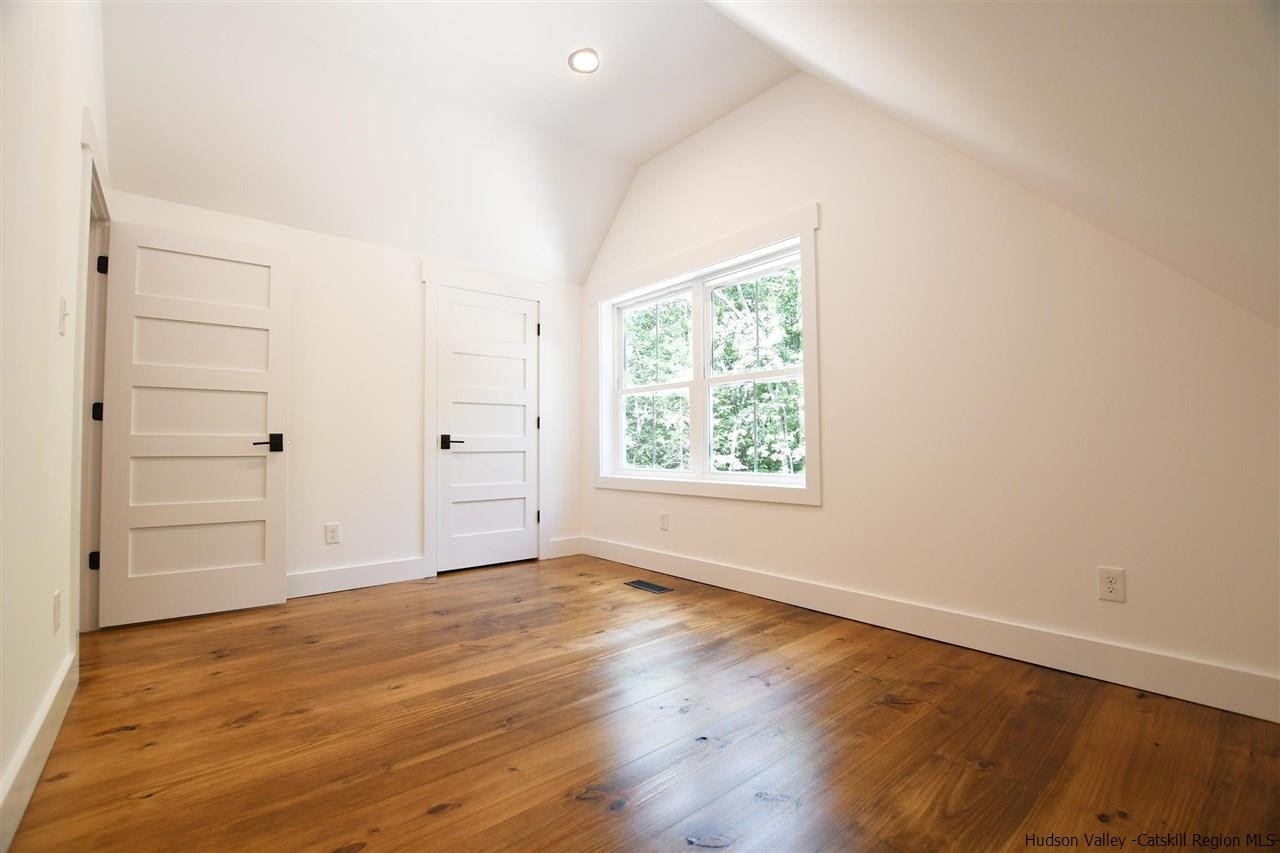 259 Rivka Road Saugerties, NY 12477 - Photo 13 of 29 an empty room with wooden floor and window