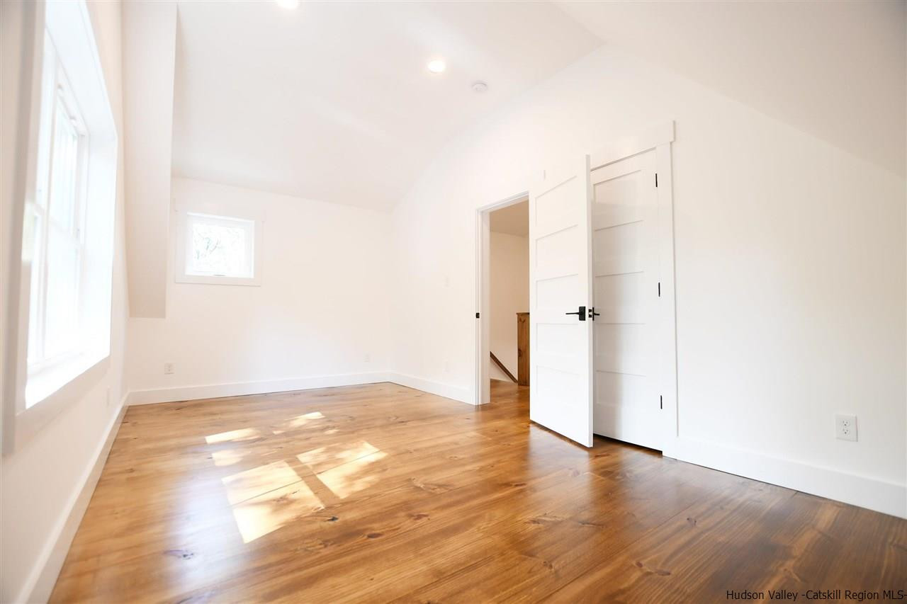 259 Rivka Road Saugerties, NY 12477 - Photo 17 of 29 a view of an empty room with wooden floor