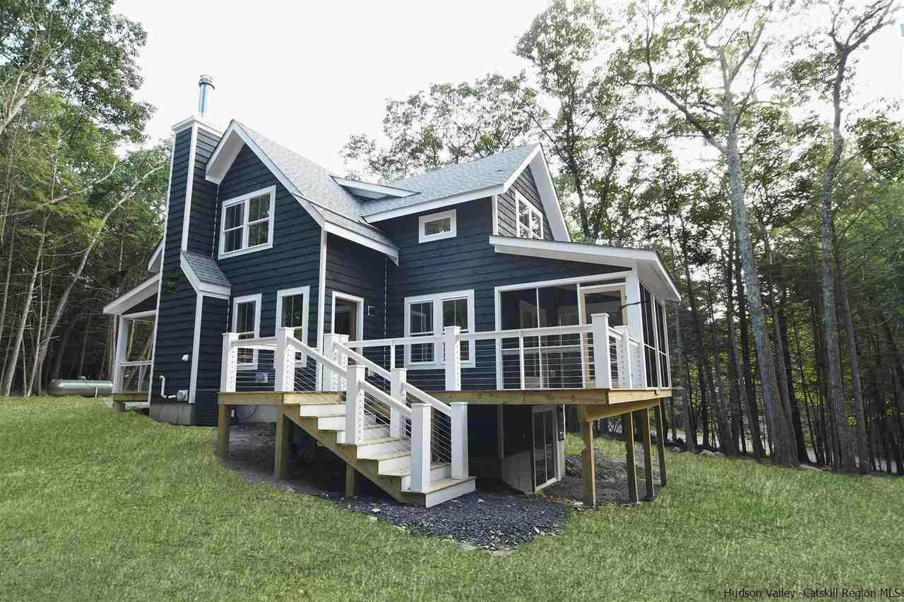 259 Rivka Road Saugerties, NY 12477 - Photo 24 of 29 a view of a house with a yard and sitting area