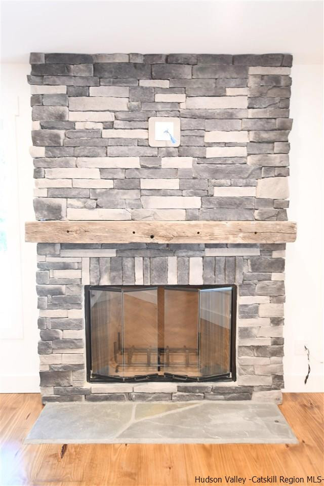 259 Rivka Road Saugerties, NY 12477 - Photo 4 of 29 a view of fireplace and wooden floor
