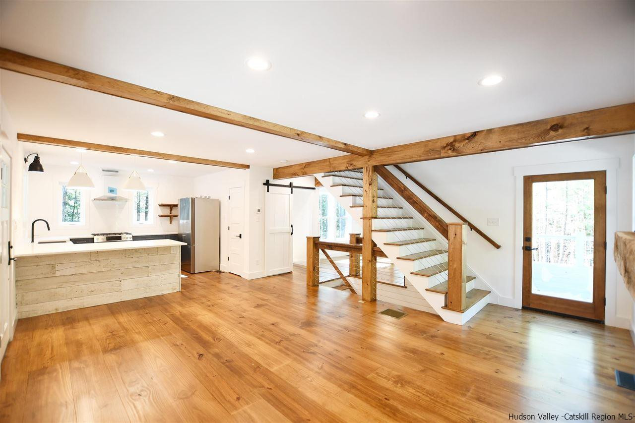 259 Rivka Road Saugerties, NY 12477 - Photo 5 of 29 a large white kitchen with wooden floor and a sink