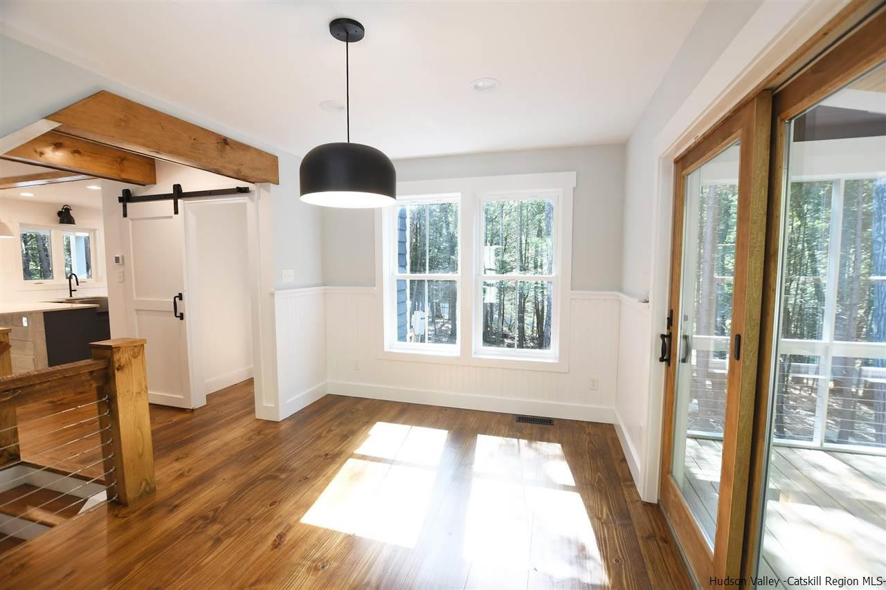259 Rivka Road Saugerties, NY 12477 - Photo 6 of 29 a view of an entryway with a floor to ceiling window and wooden floor
