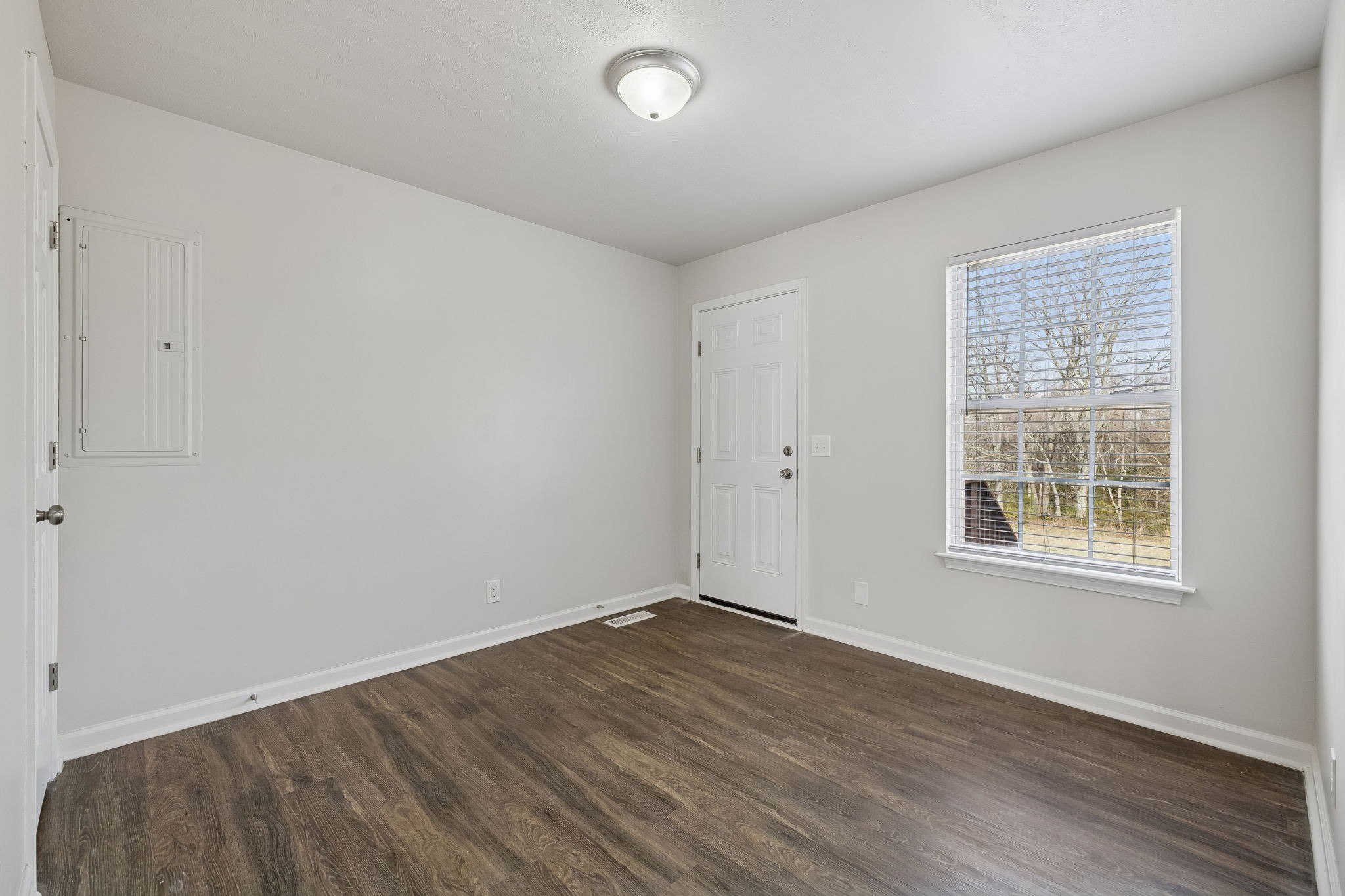 2607 Landrum Court, Unit 16 Springfield, TN 37172 - Photo 12 of 30 an empty room with wooden floor and windows