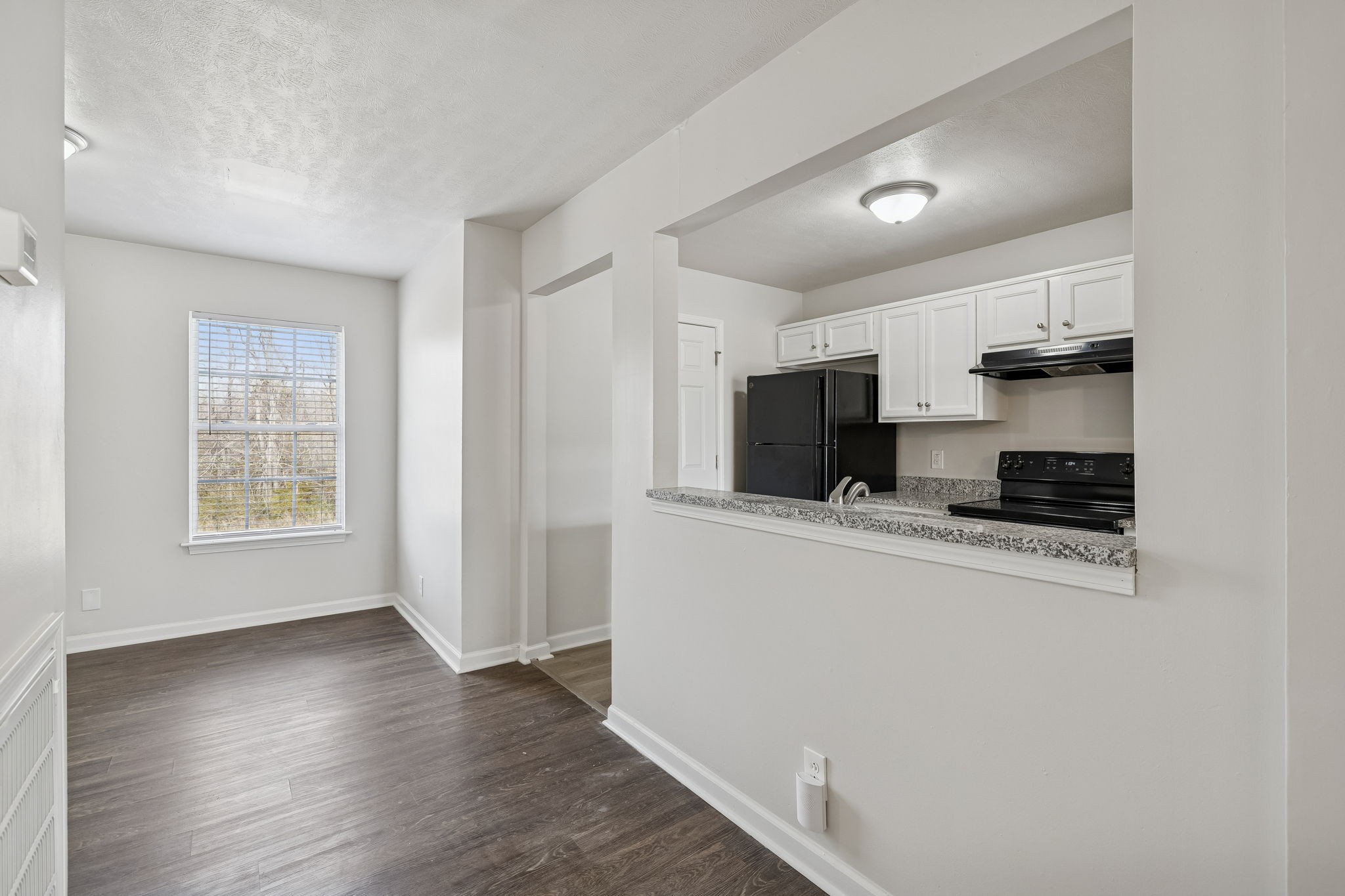 2607 Landrum Court, Unit 16 Springfield, TN 37172 - Photo 13 of 30 a kitchen with stainless steel appliances a sink a stove a microwave a refrigerator a window