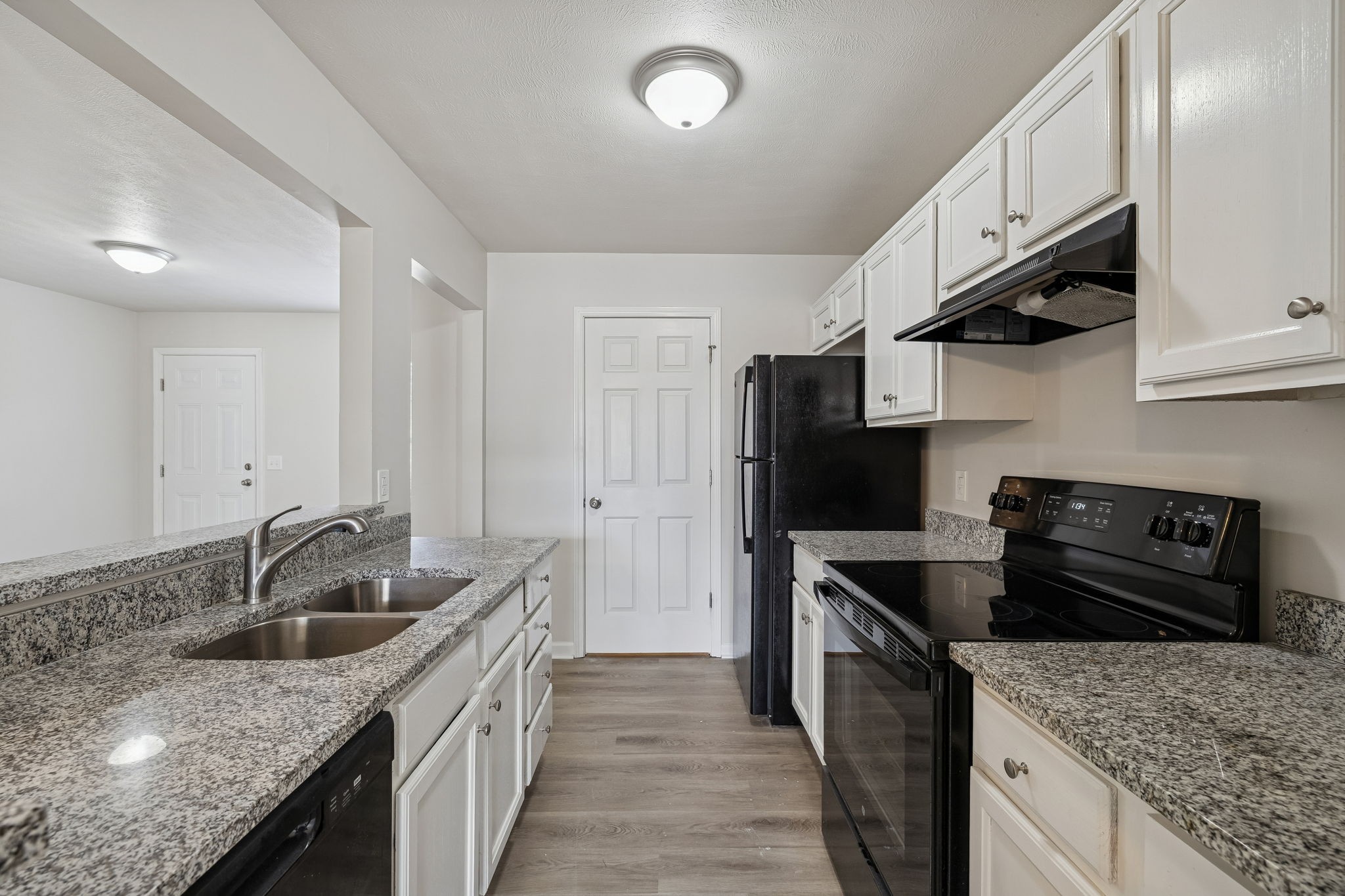 2607 Landrum Court, Unit 16 Springfield, TN 37172 - Photo 14 of 30 a kitchen with stainless steel appliances granite countertop a sink stove and refrigerator