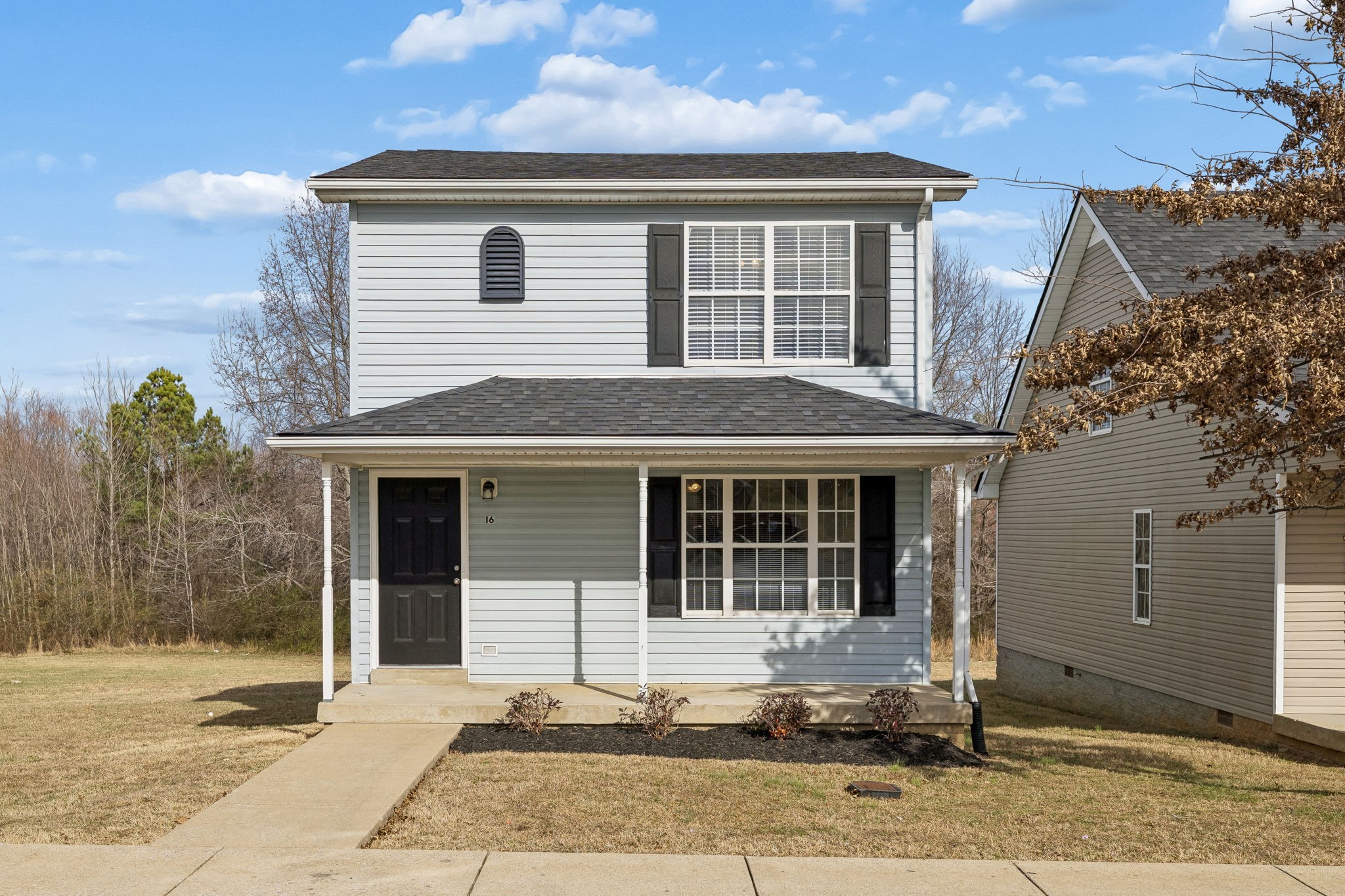 2607 Landrum Court, Unit 16 Springfield, TN 37172 - Photo 2 of 30 a front view of a house with a yard