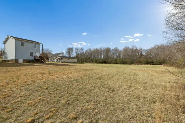 a view of a yard with an outdoor space