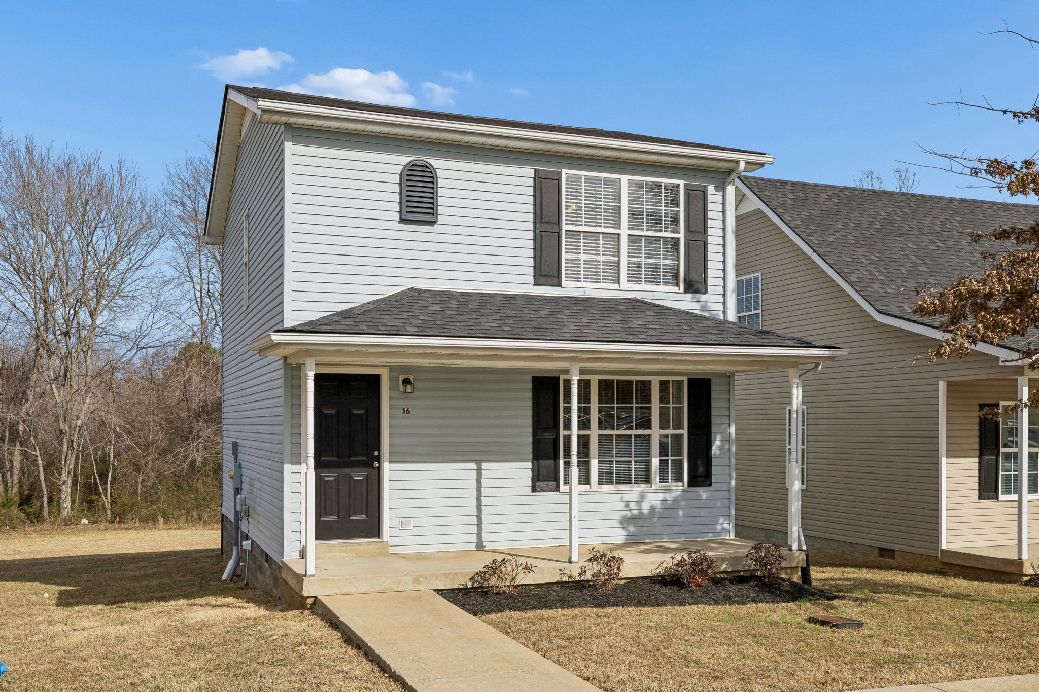 2607 Landrum Court, Unit 16 Springfield, TN 37172 - Photo 4 of 30 a front view of a house with a garden