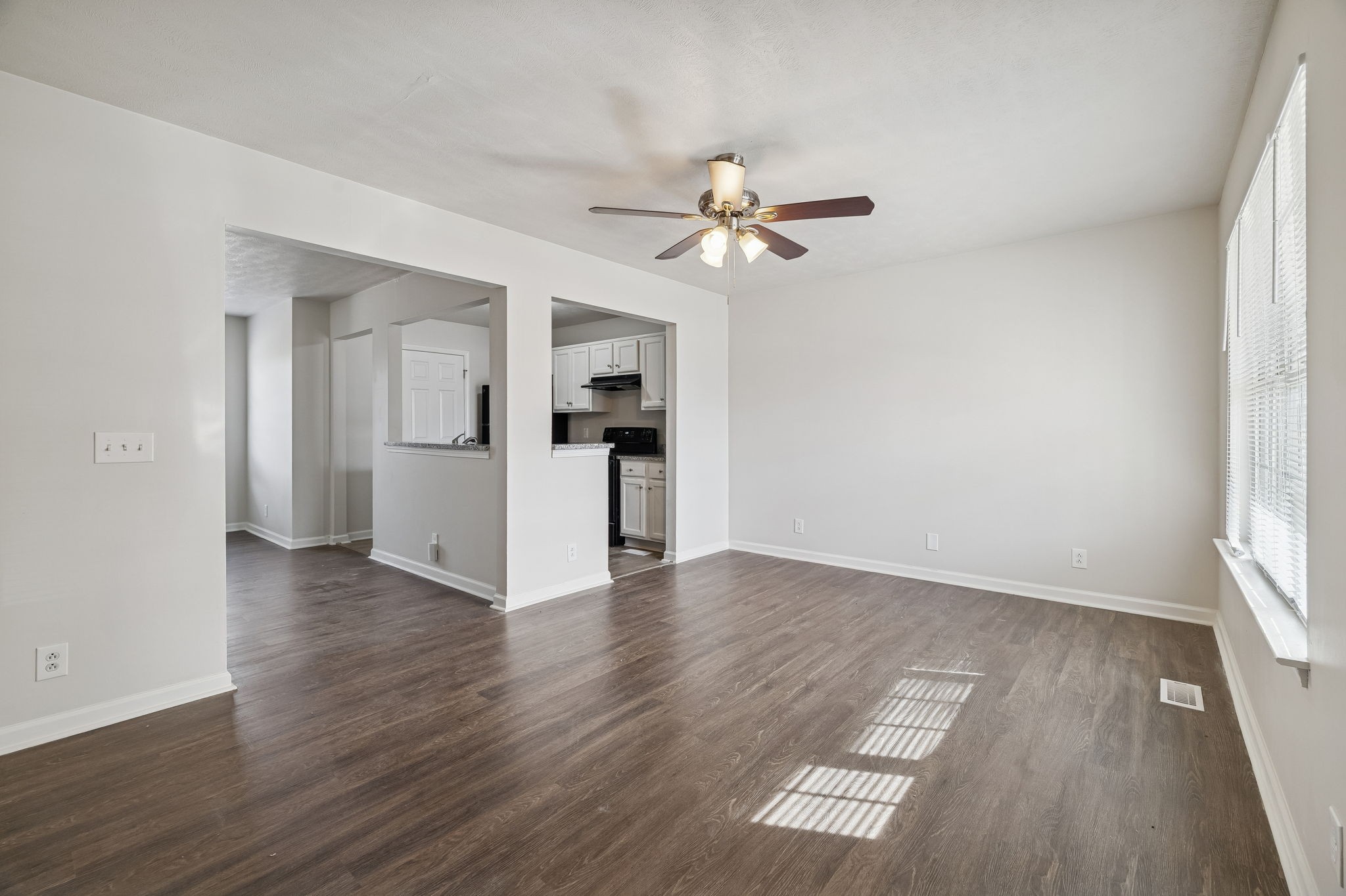 2607 Landrum Court, Unit 16 Springfield, TN 37172 - Photo 5 of 30 wooden floor in an empty room with a window