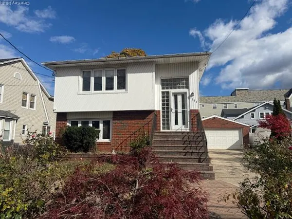 a front view of a house with street