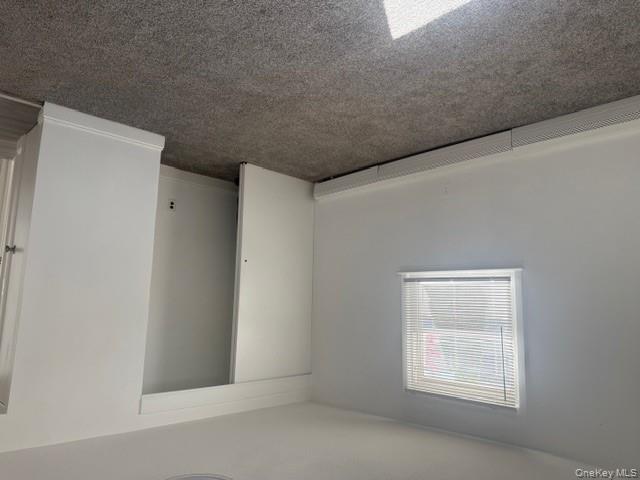 306 Hamilton Avenue, Unit 1 Hewlett, NY 11557 - Photo 11 of 18 an empty room with windows