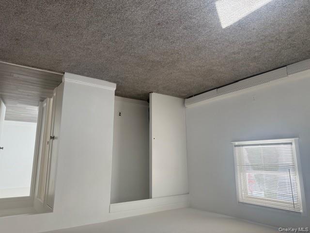 306 Hamilton Avenue, Unit 1 Hewlett, NY 11557 - Photo 12 of 18 an empty room with windows