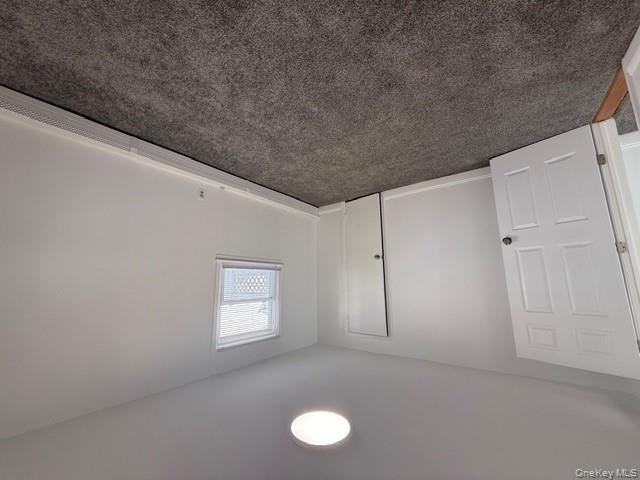 306 Hamilton Avenue, Unit 1 Hewlett, NY 11557 - Photo 13 of 18 an empty room with a fan & a window