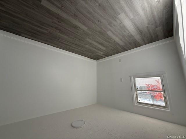 306 Hamilton Avenue, Unit 1 Hewlett, NY 11557 - Photo 17 of 18 a view of a room with wooden floor and white walls