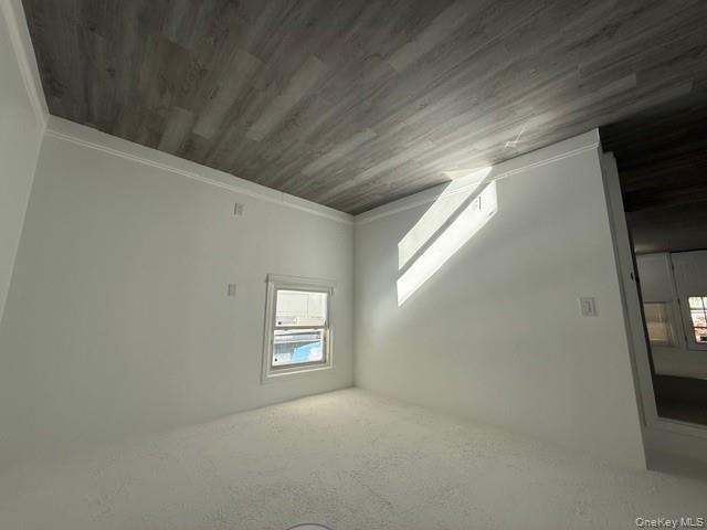 306 Hamilton Avenue, Unit 1 Hewlett, NY 11557 - Photo 18 of 18 an empty room with wooden floor and windows