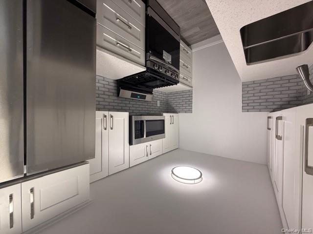 306 Hamilton Avenue, Unit 1 Hewlett, NY 11557 - Photo 6 of 18 a kitchen with a sink stove and refrigerator