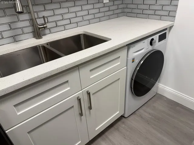 a utility room with dryer and washer