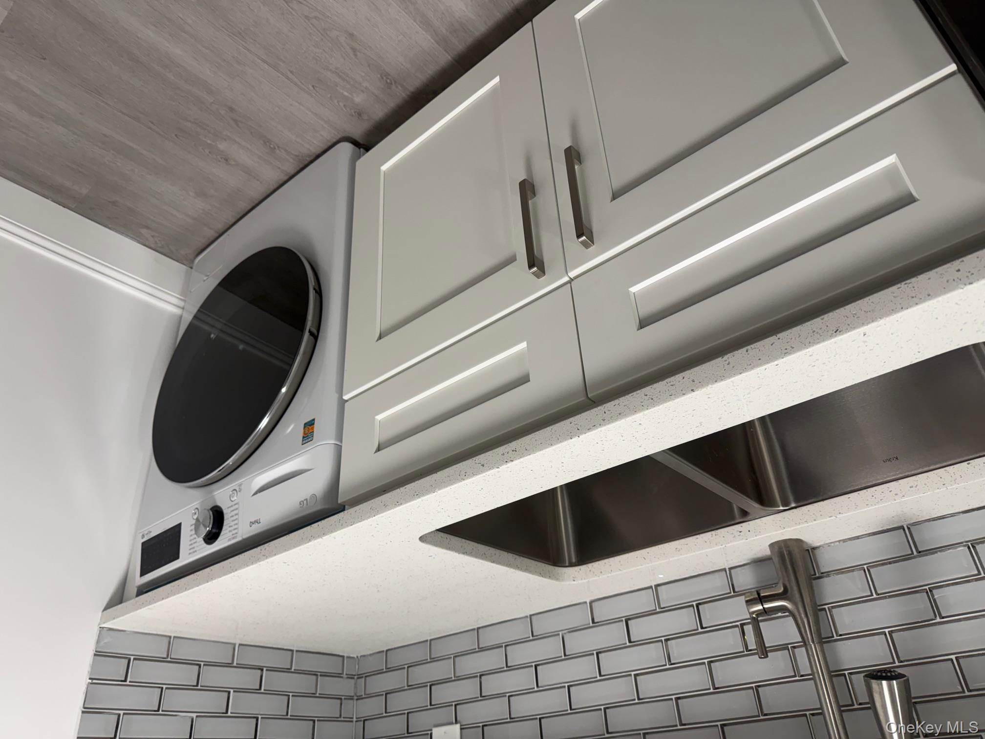 306 Hamilton Avenue, Unit 1 Hewlett, NY 11557 - Photo 9 of 18 a utility room with dryer and washer