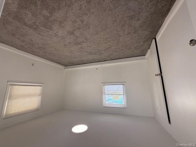 306 Hamilton Avenue, Unit 1 Hewlett, NY 11557 - Photo 10 of 18 an empty room with a window