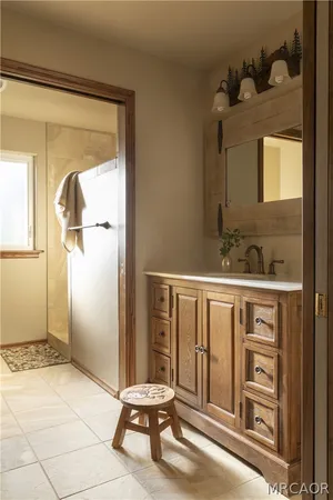 a bathroom with a sink and a mirror