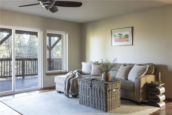 a living room with furniture and a window