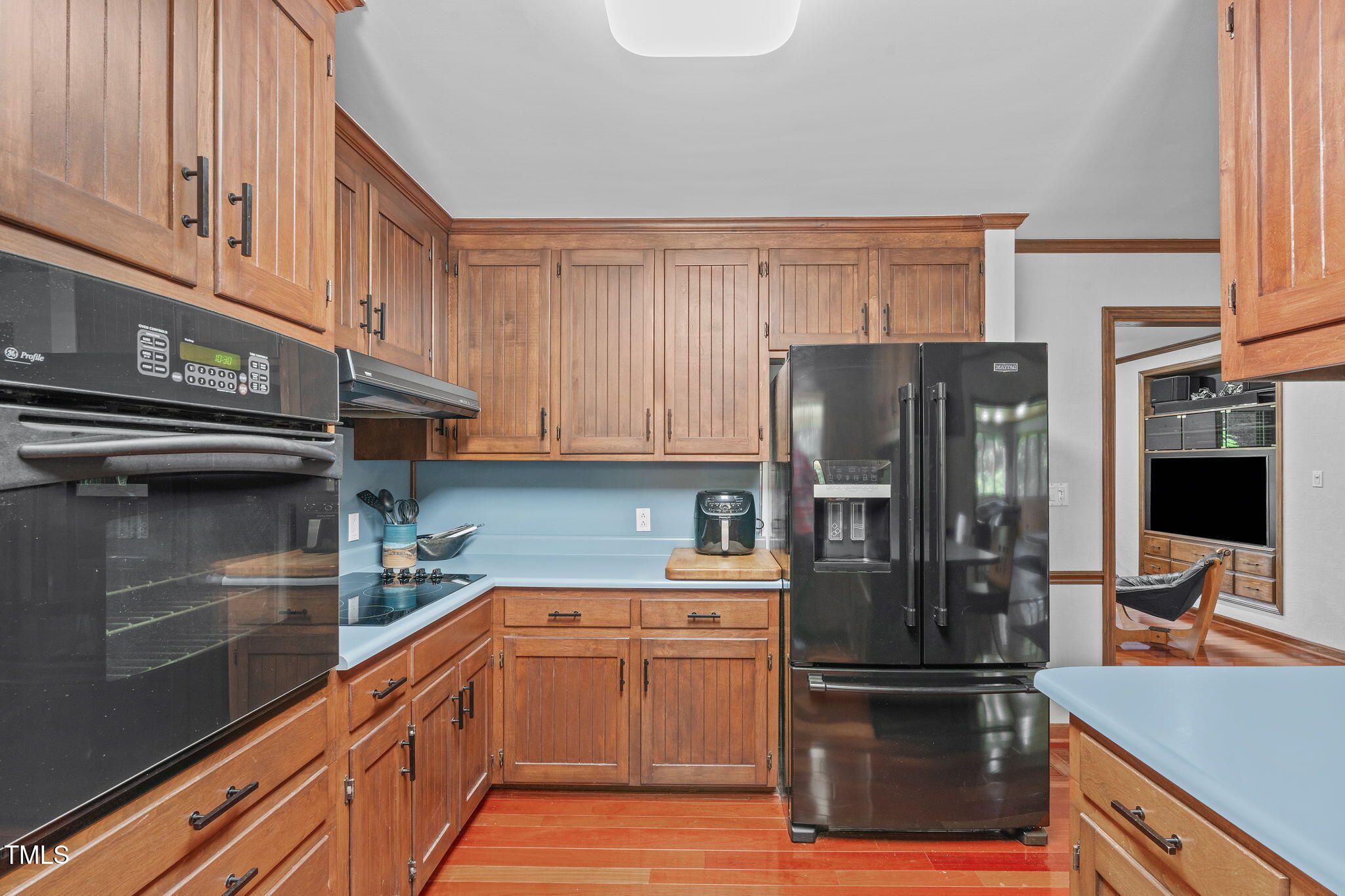 411 Tant Road Zebulon, NC 27597 - Photo 14 of 48 a kitchen with stainless steel appliances granite countertop a refrigerator and a stove
