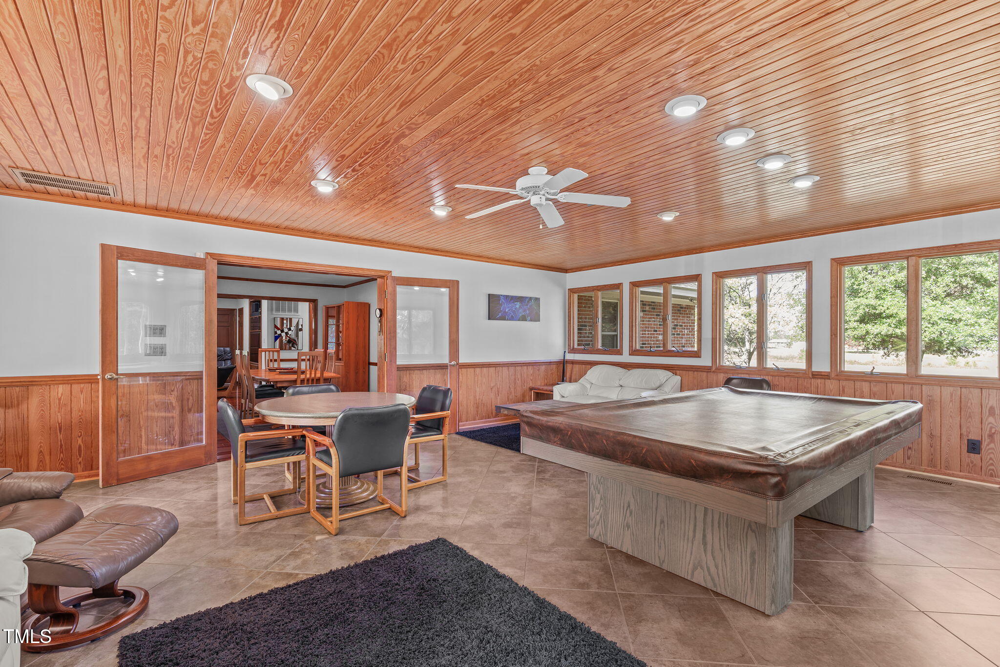 411 Tant Road Zebulon, NC 27597 - Photo 15 of 48 a dining room with wooden floor and furniture