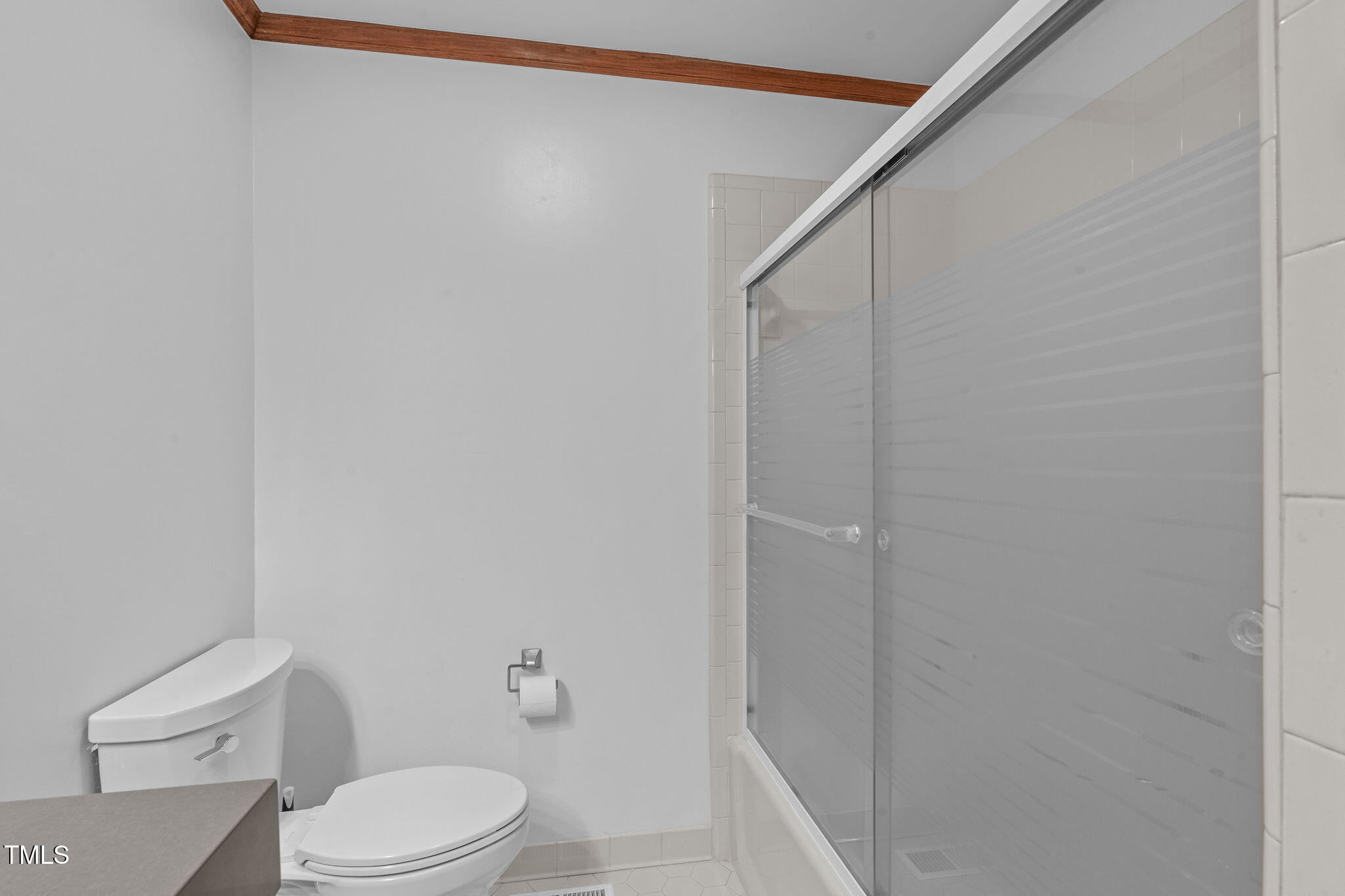 411 Tant Road Zebulon, NC 27597 - Photo 20 of 48 a white toilet sitting next to a shower