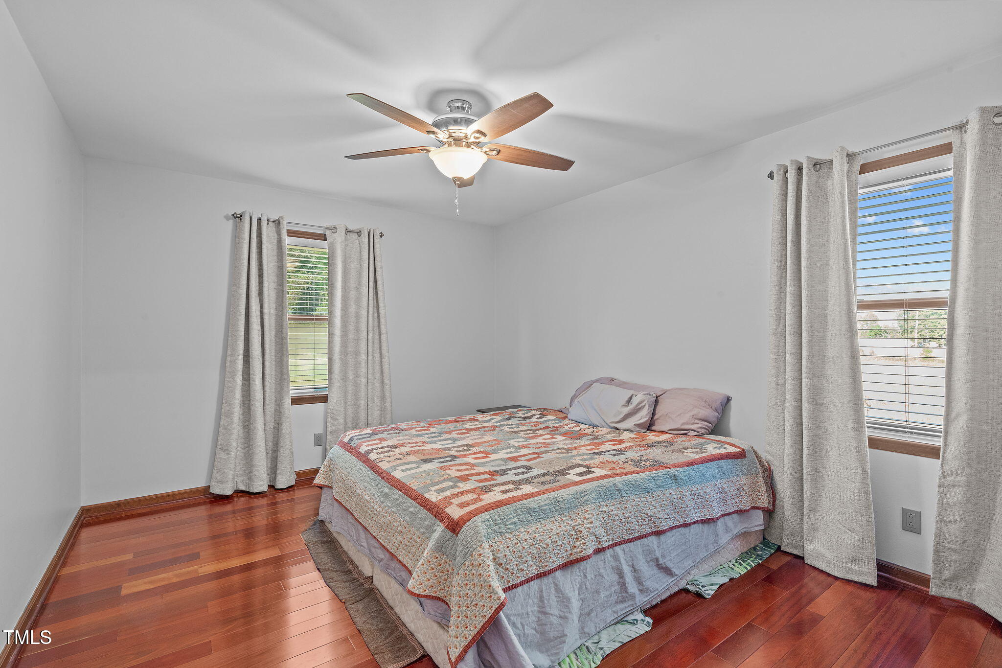 411 Tant Road Zebulon, NC 27597 - Photo 21 of 48 a bedroom with a bed and a window