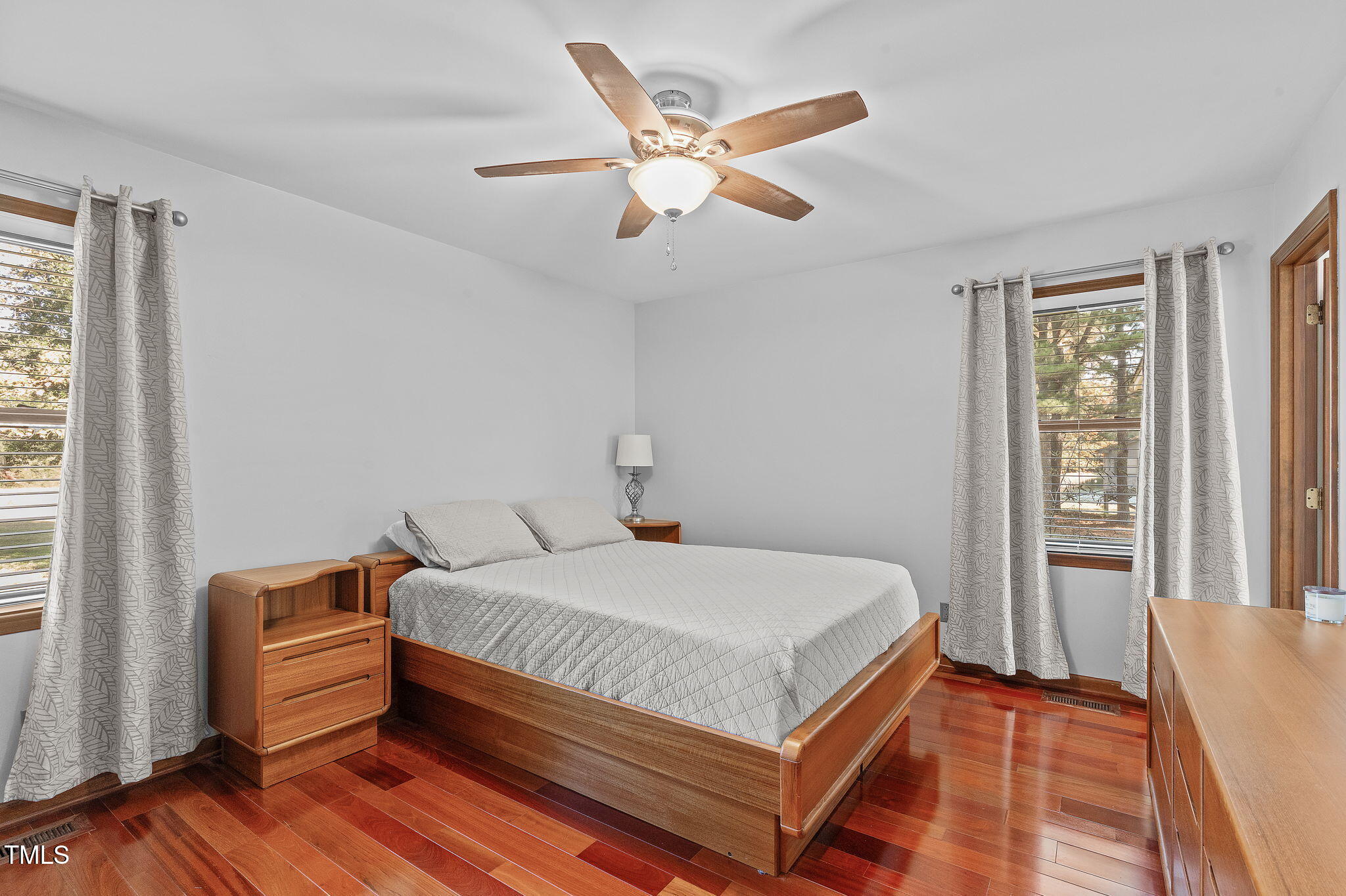 411 Tant Road Zebulon, NC 27597 - Photo 23 of 48 a bedroom with a bed and window