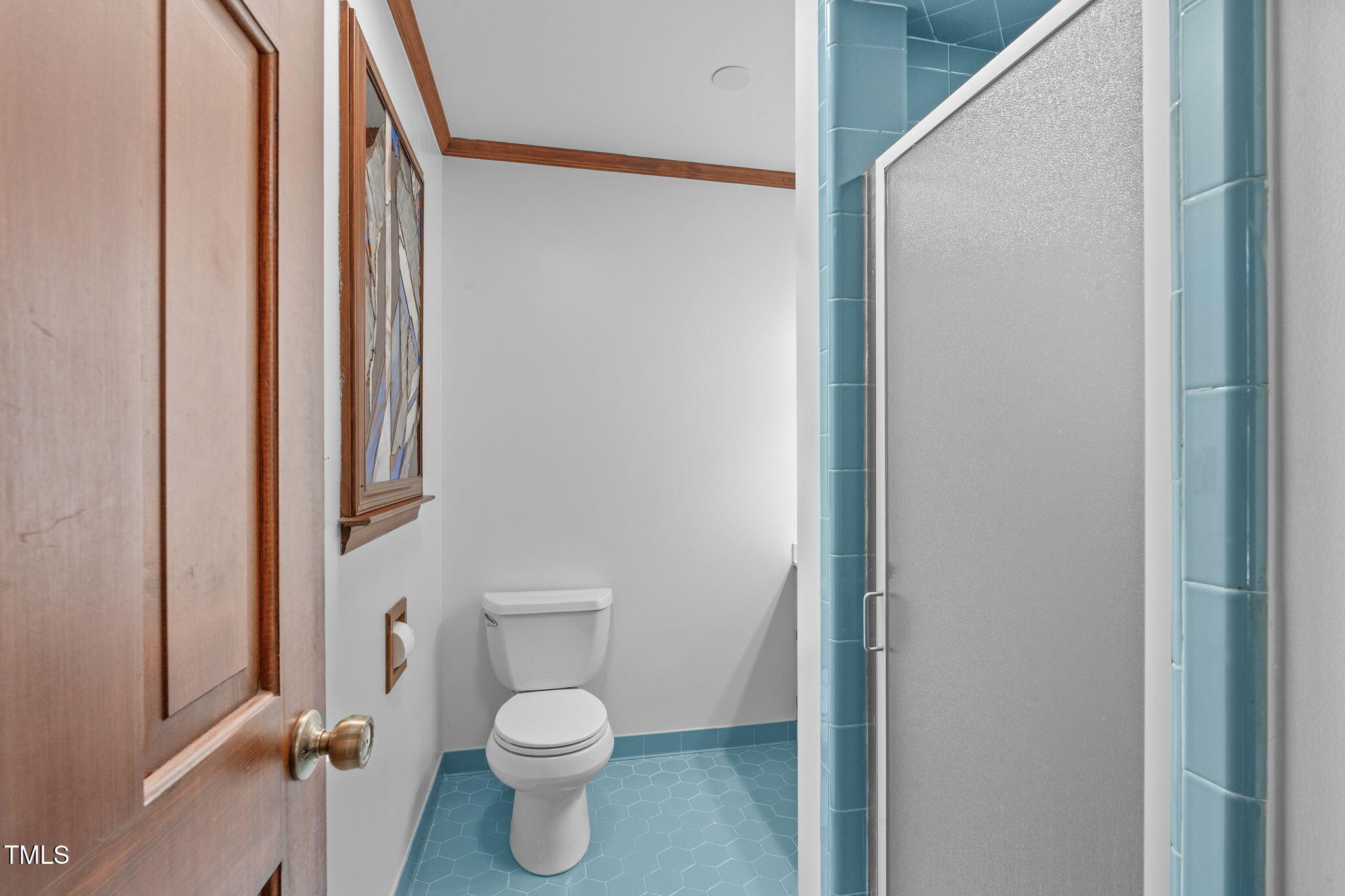411 Tant Road Zebulon, NC 27597 - Photo 25 of 48 a bathroom with a toilet and a shower