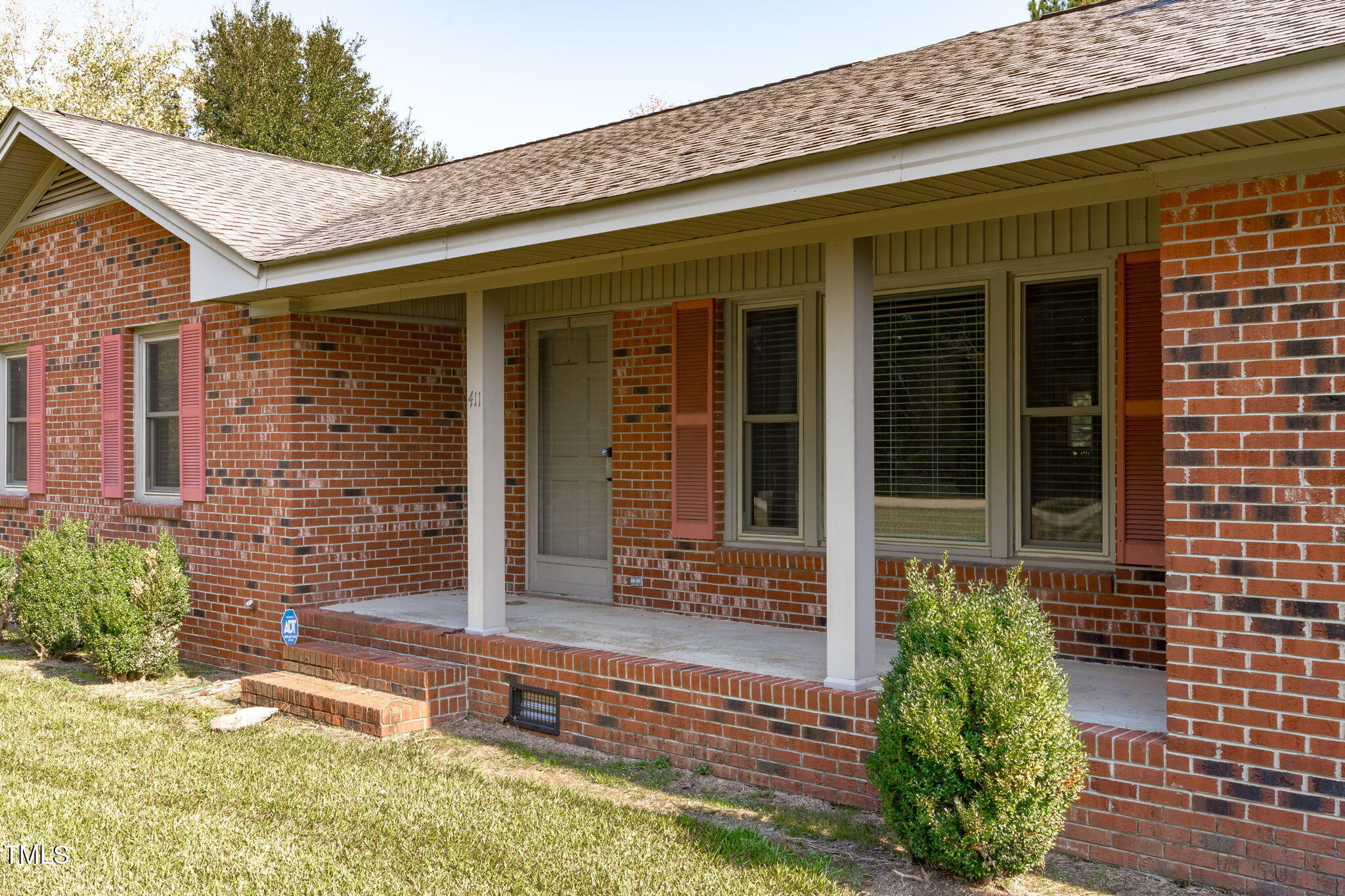 411 Tant Road Zebulon, NC 27597 - Photo 3 of 48 front view of a brick house with a large window