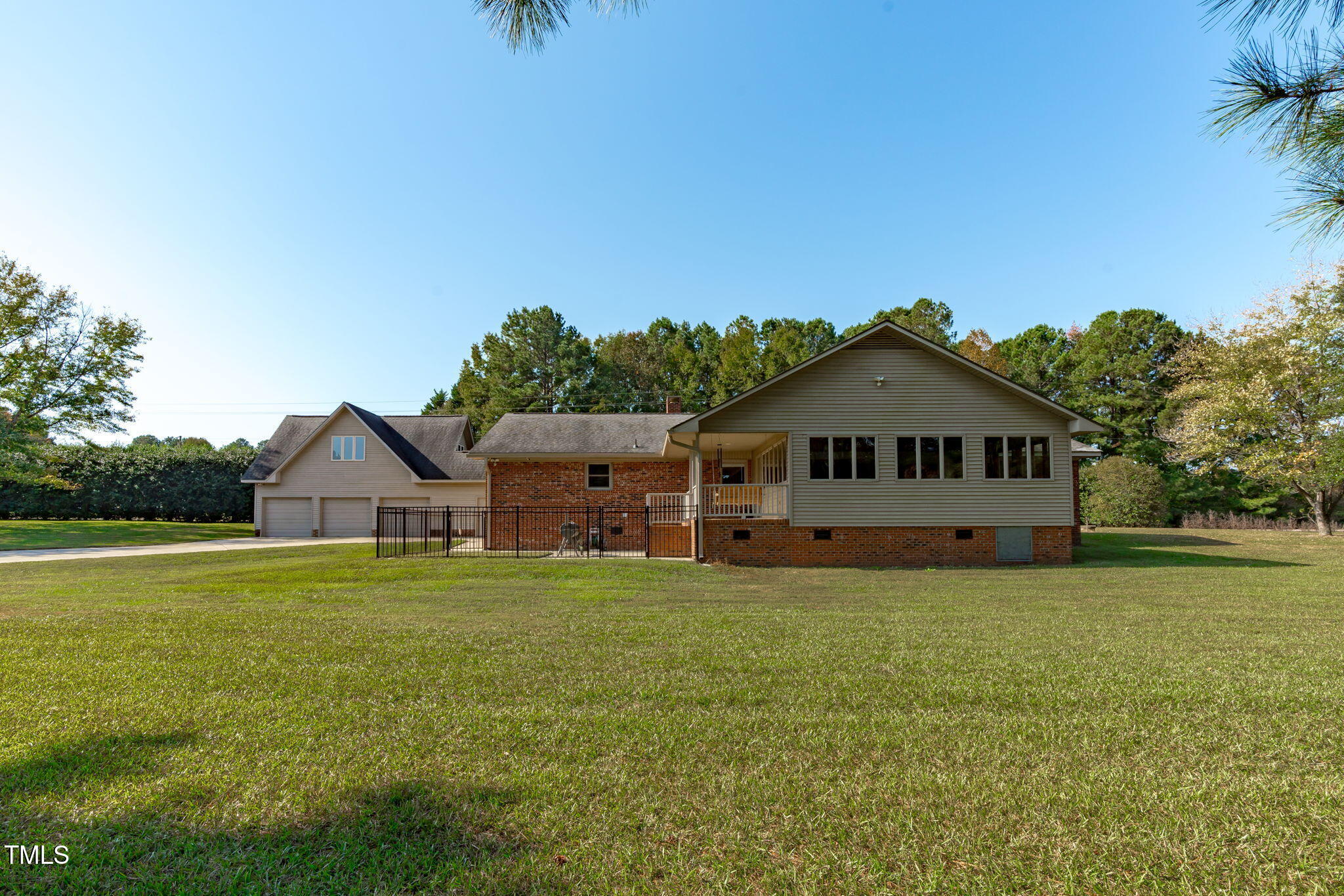 411 Tant Road Zebulon, NC 27597 - Photo 32 of 48 a house with a big yard