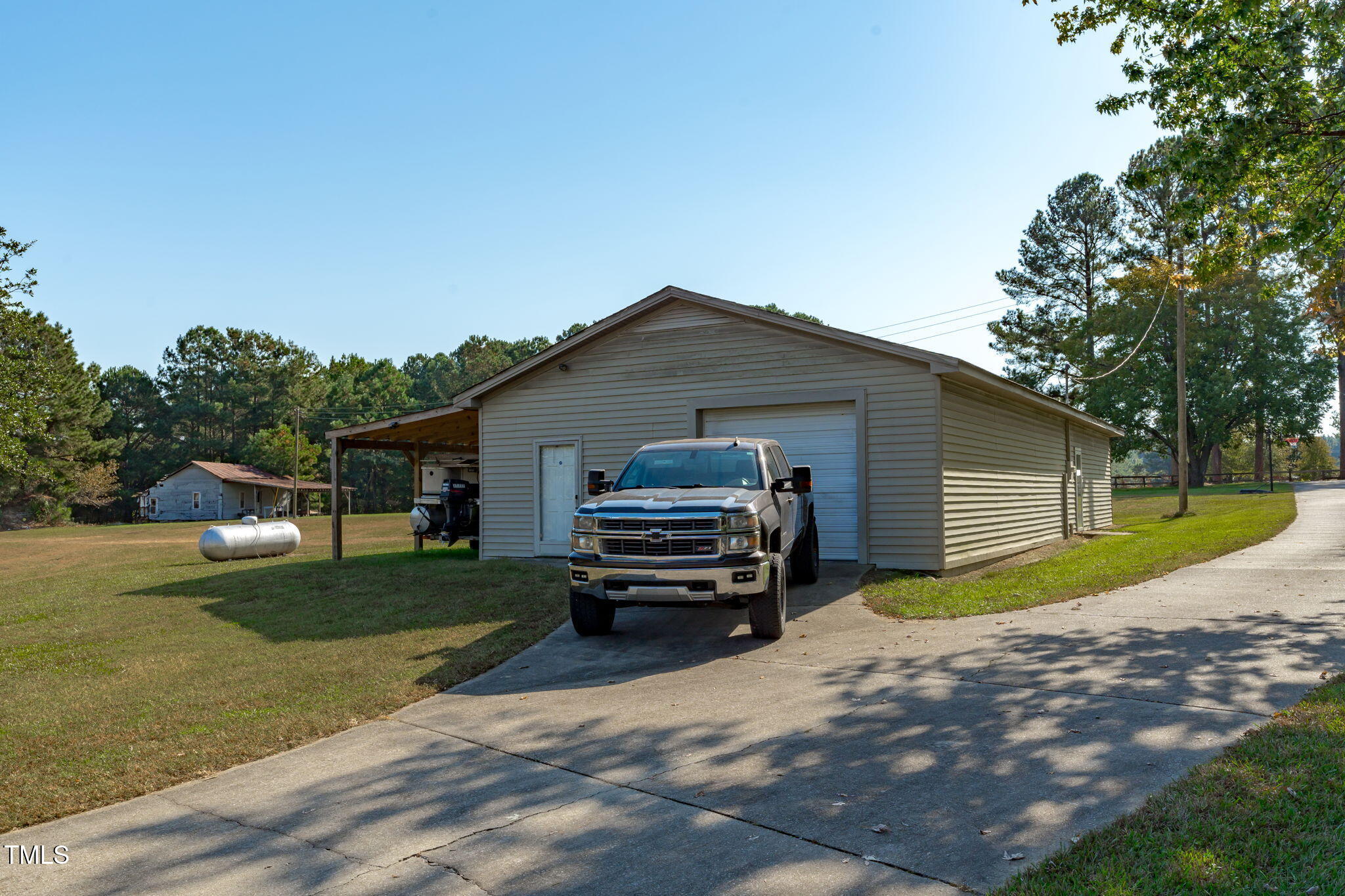 411 Tant Road Zebulon, NC 27597 - Photo 38 of 48 a front view of a house with a yard
