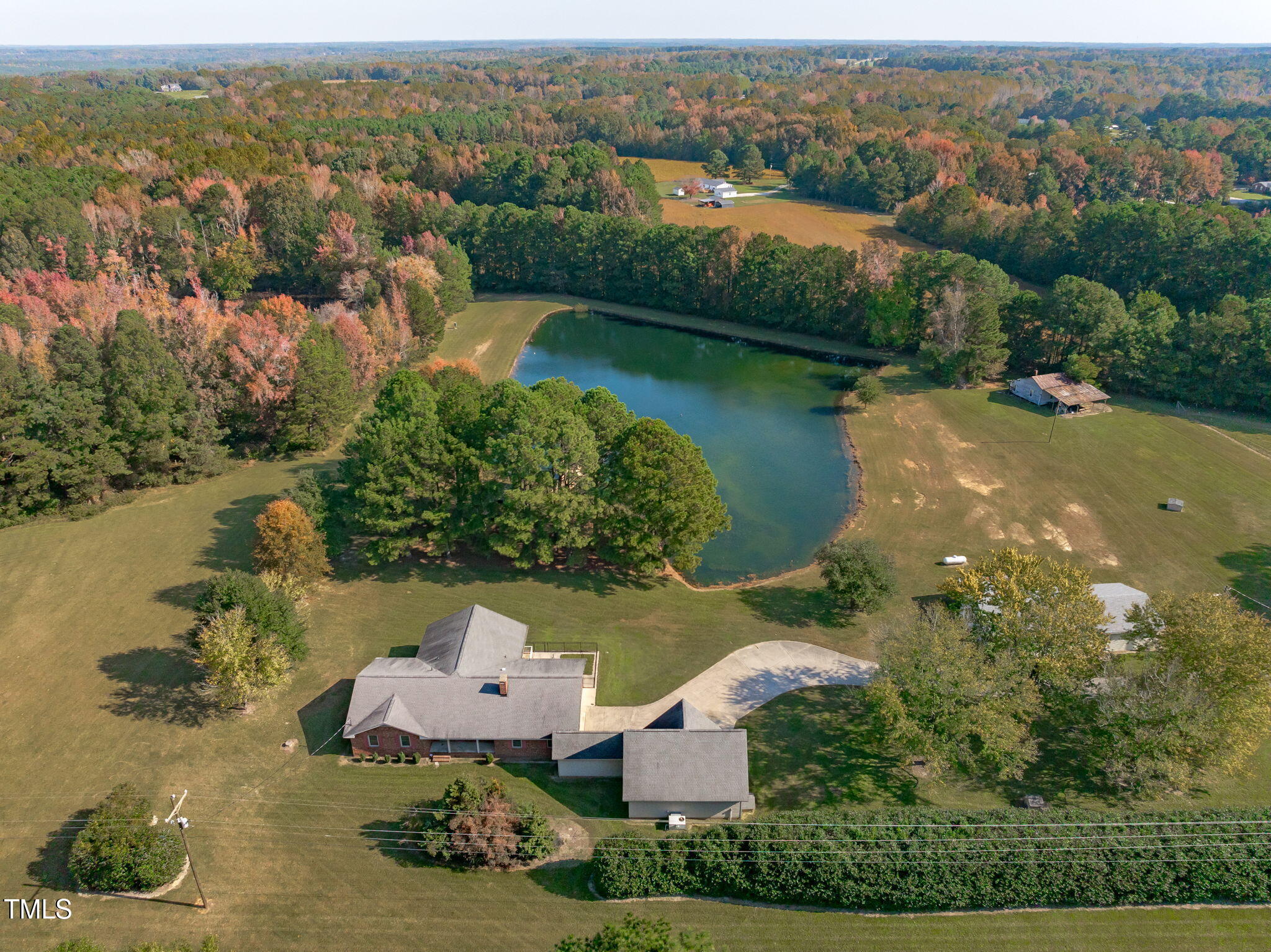 411 Tant Road Zebulon, NC 27597 - Photo 40 of 48 an aerial view of a house with a lake view