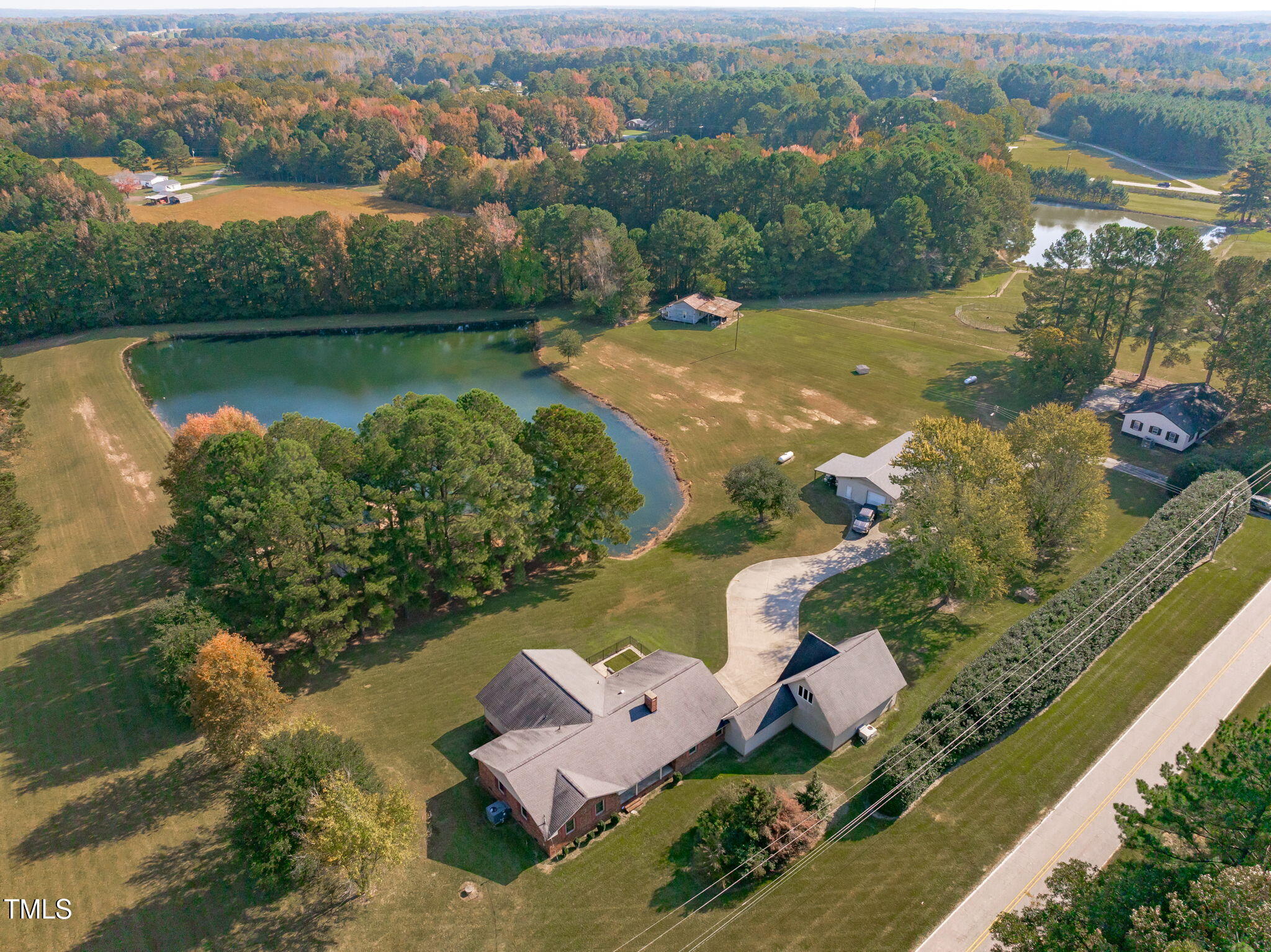 411 Tant Road Zebulon, NC 27597 - Photo 41 of 48 an aerial view of a house with a lake view