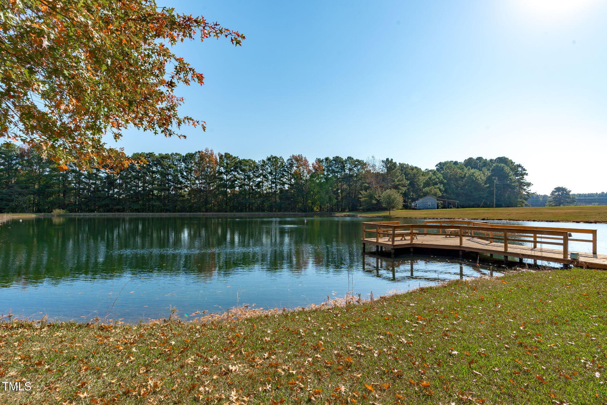 411 Tant Road Zebulon, NC 27597 - Photo 48 of 48 a view of a lake with boats and trees in the background