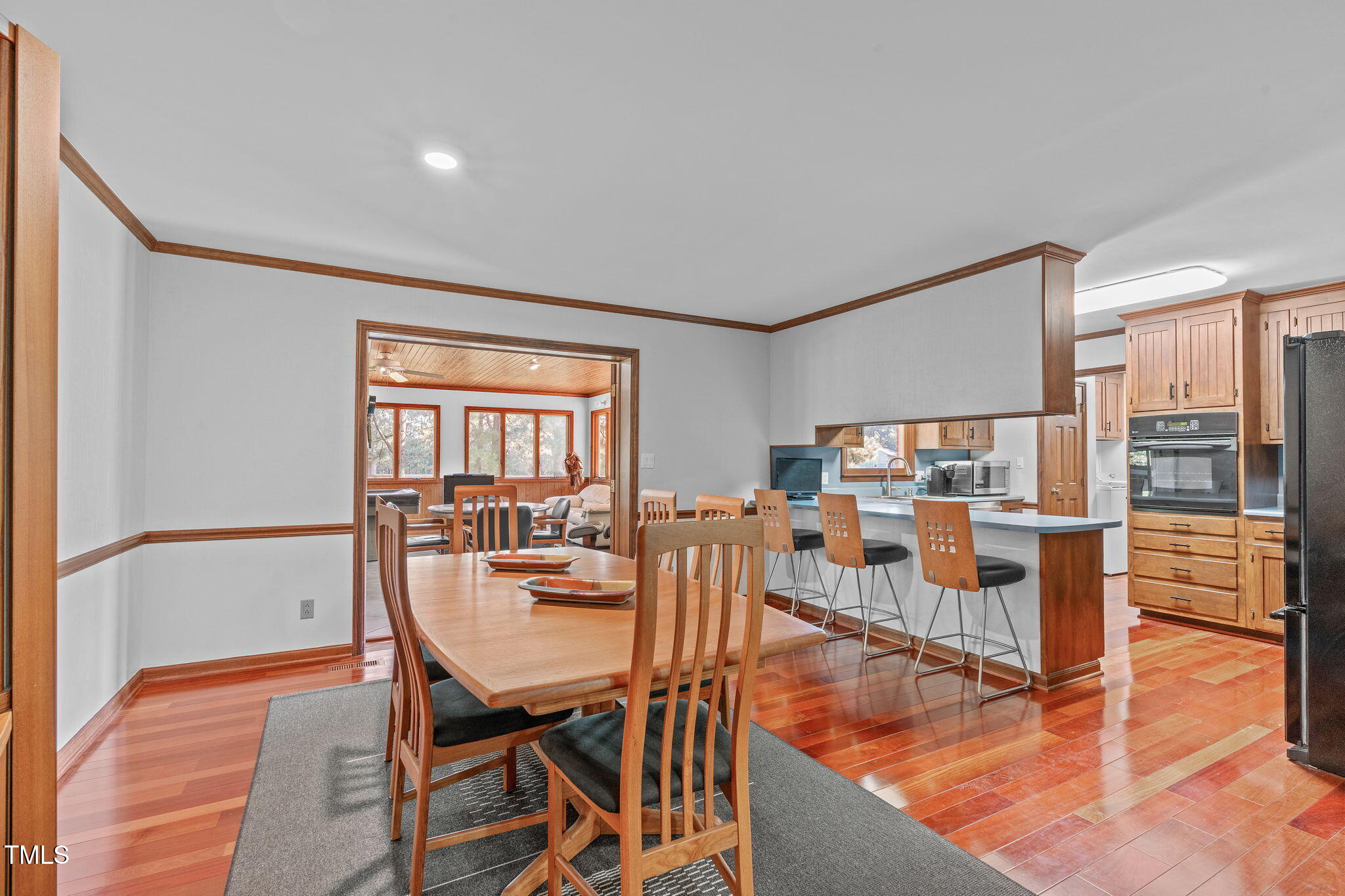 411 Tant Road Zebulon, NC 27597 - Photo 9 of 48 a living room with dining room and wooden floor