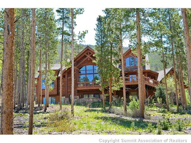 317 Mountain Bluebell Road Keystone, CO 80435 - Photo 2 of 25 a backyard of a house with lots of green space and fountain