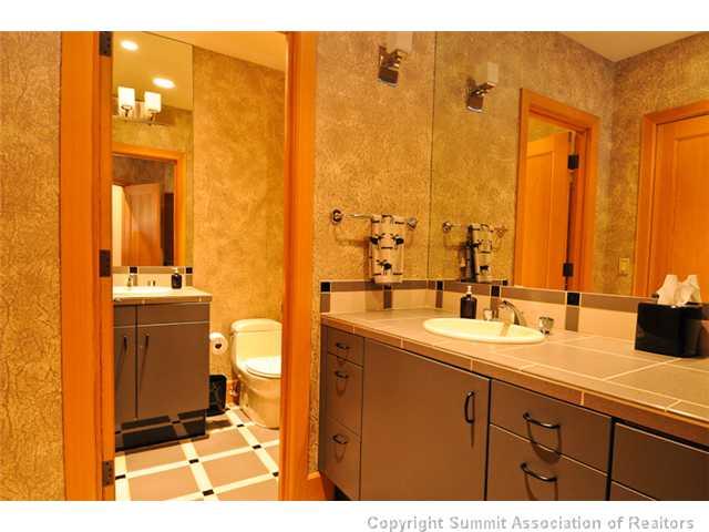317 Mountain Bluebell Road Keystone, CO 80435 - Photo 16 of 25 a bathroom with a double vanity sink and mirror