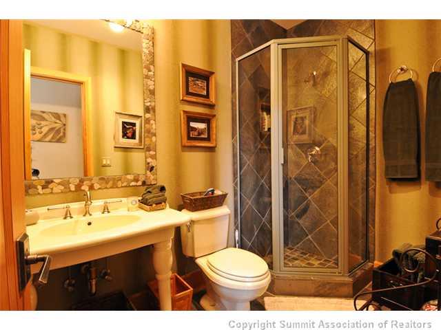 317 Mountain Bluebell Road Keystone, CO 80435 - Photo 18 of 25 a bathroom with a sink mirror toilet and shower