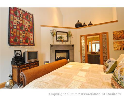 317 Mountain Bluebell Road Keystone, CO 80435 - Photo 20 of 25 a bedroom with a bed and a television
