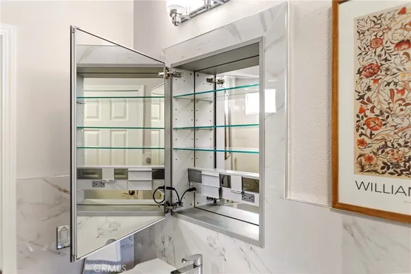 a sitting area with glass door