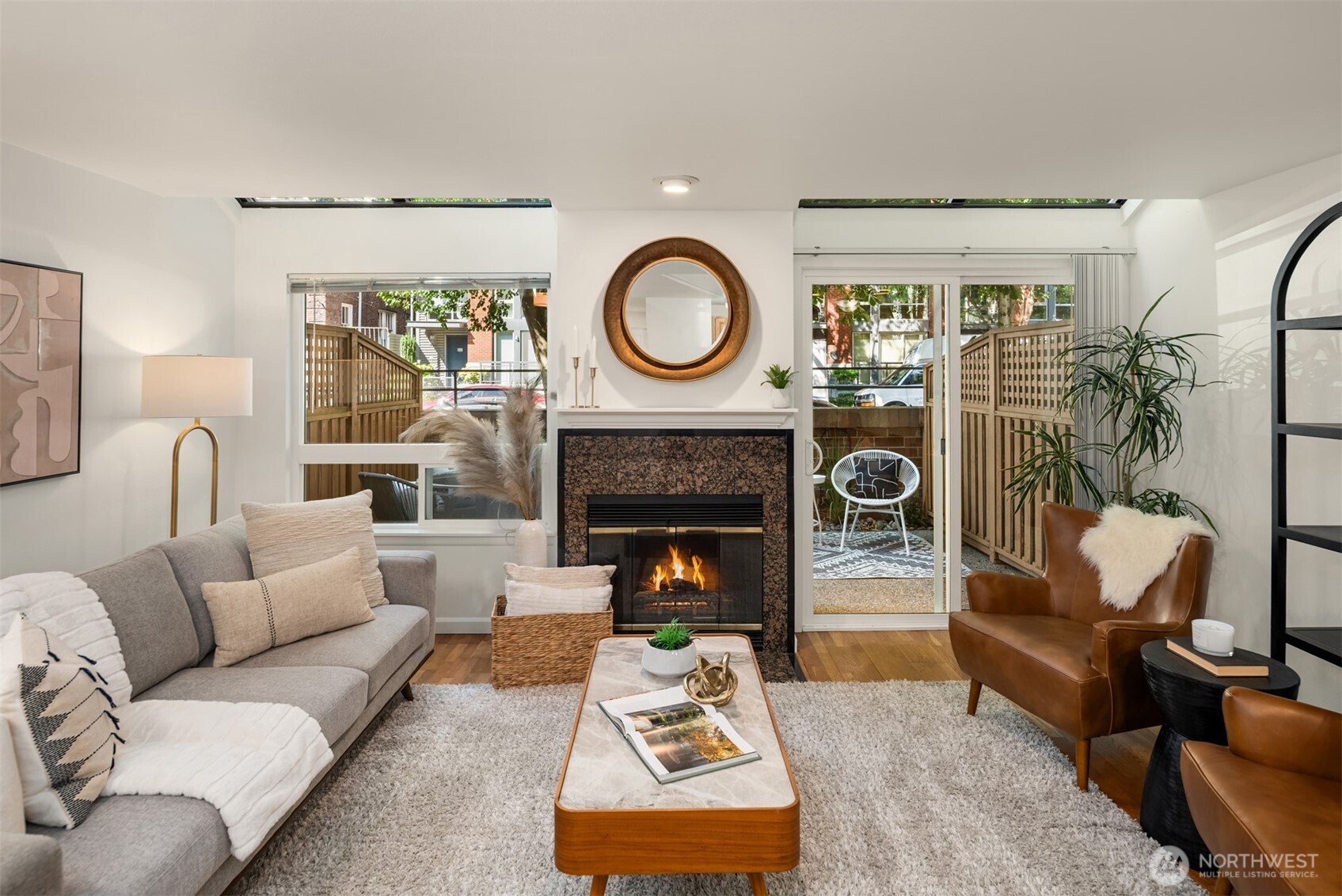a living room with furniture and a fireplace
