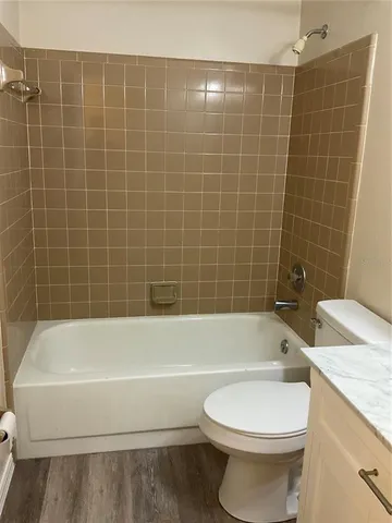 a bathroom with a bathtub and toilet