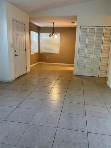 a view of a livingroom with an empty space and window