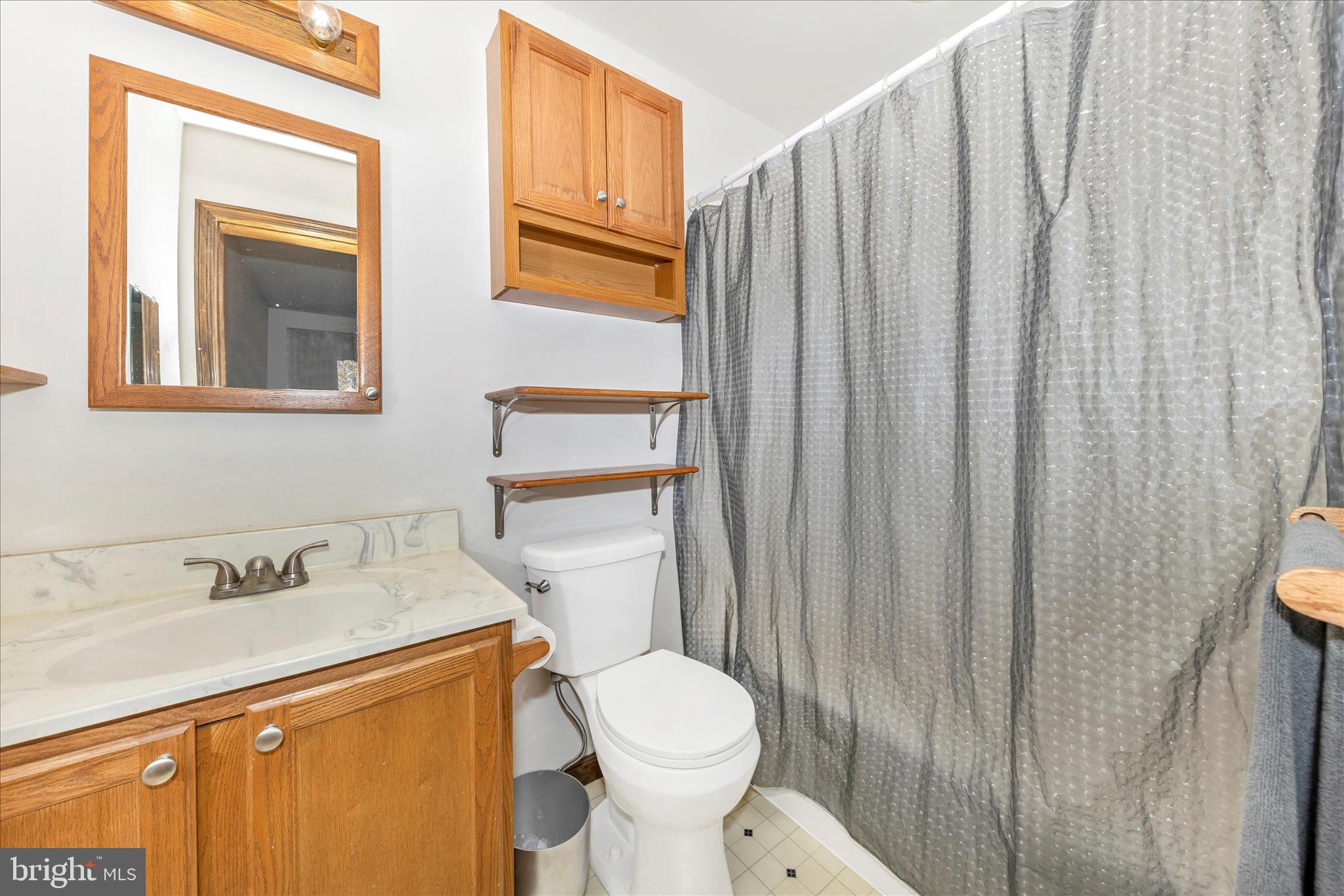 7 Colleen Trail Fairfield, PA 17320 - Photo 20 of 47 a bathroom with a sink a toilet and shower curtain