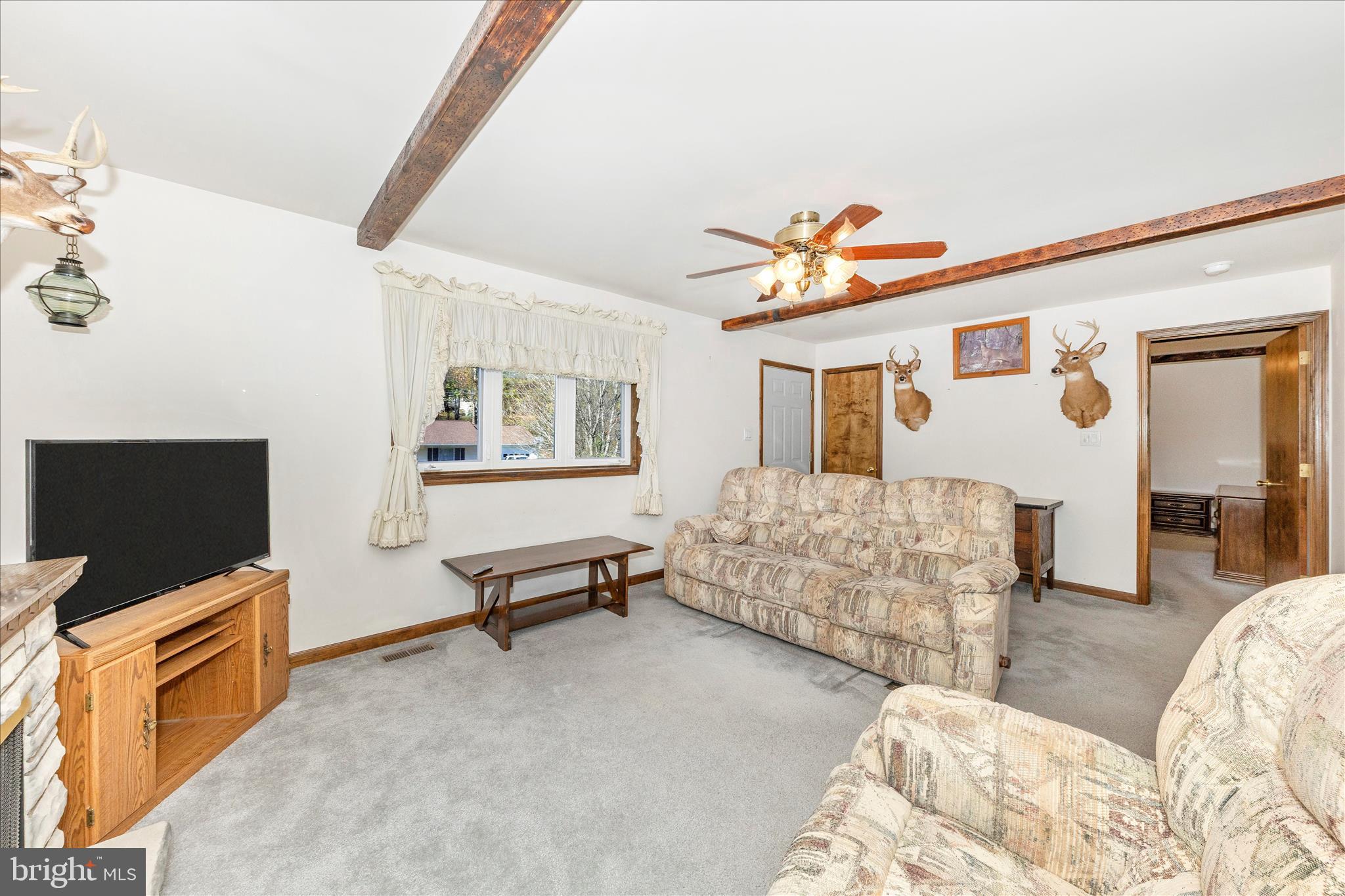 7 Colleen Trail Fairfield, PA 17320 - Photo 5 of 47 a living room with furniture and a flat screen tv