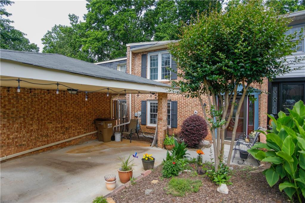 a front view of a house with sitting area