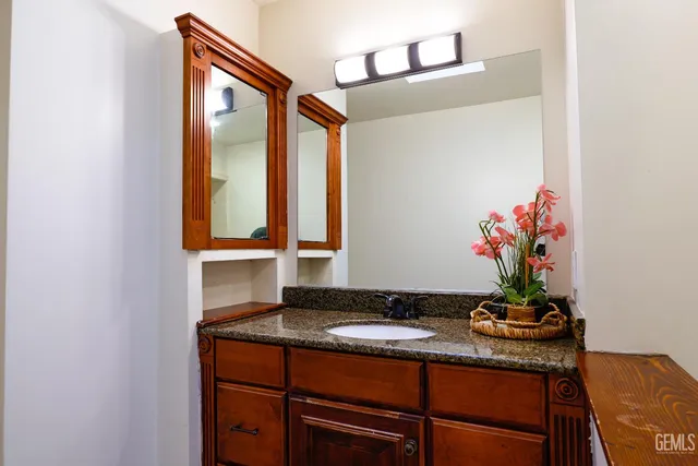 an aerial view of a house with a garden and lake view